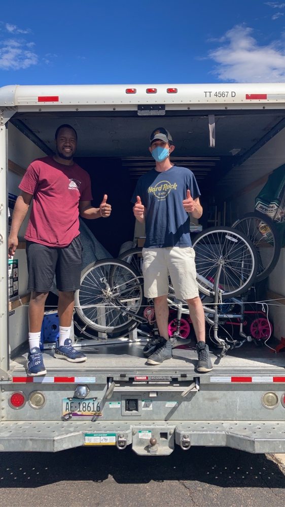 Two movers with a loaded 17-foot truck