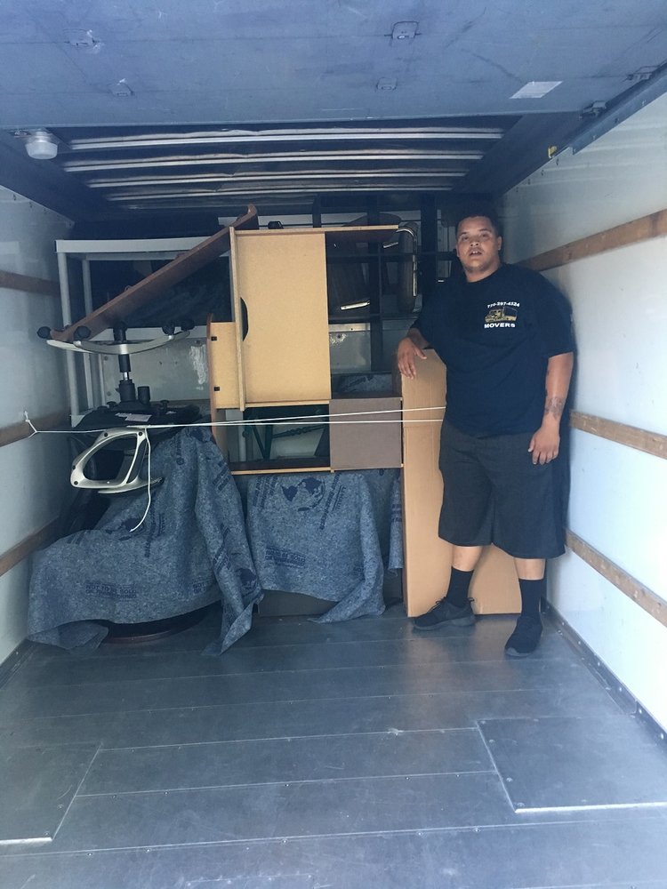 An Anytime Movers crew clearing and loading a property